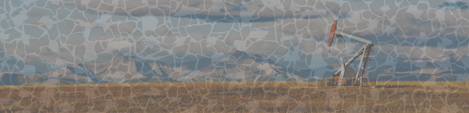 an oil derrick in the foreground and mountains in the background, overlaid with a chip used in ccs testing